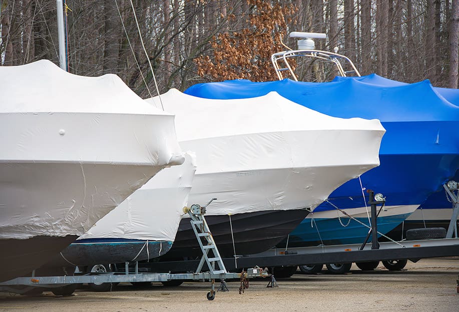 Wrapped boats on trailers.